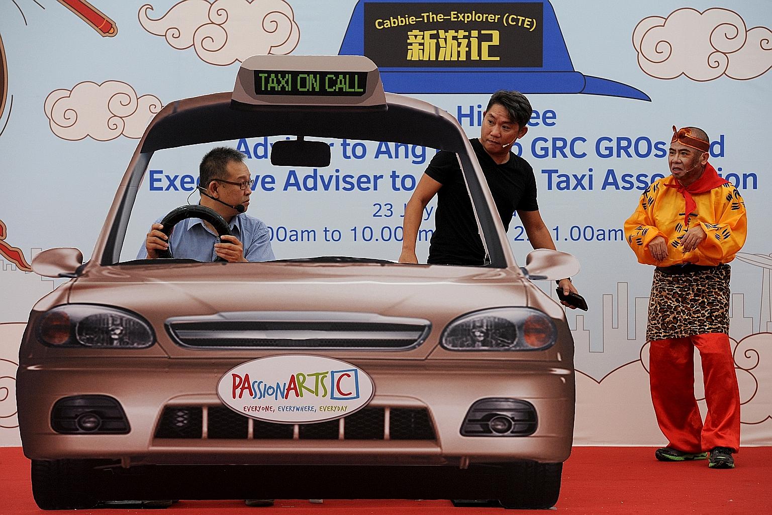Cabbies Ng Kah Leong (left), 47, and Tan Soon Heng (right), who played the Monkey God, as well as Mr Arend Seah, 47, who runs a salon, playing their roles in the performance in Ang Mo Kio yesterday.