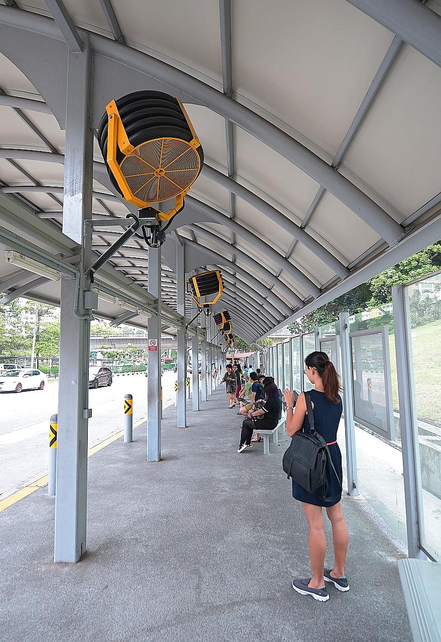 Oscillating fans at the bus stop along Ang Mo Kio Avenue 3, near Ang Mo Kio MRT station. The LTA is studying the feasibility of installing these, as well as linear-type fans for low-roofed sites, at other bus stops.
