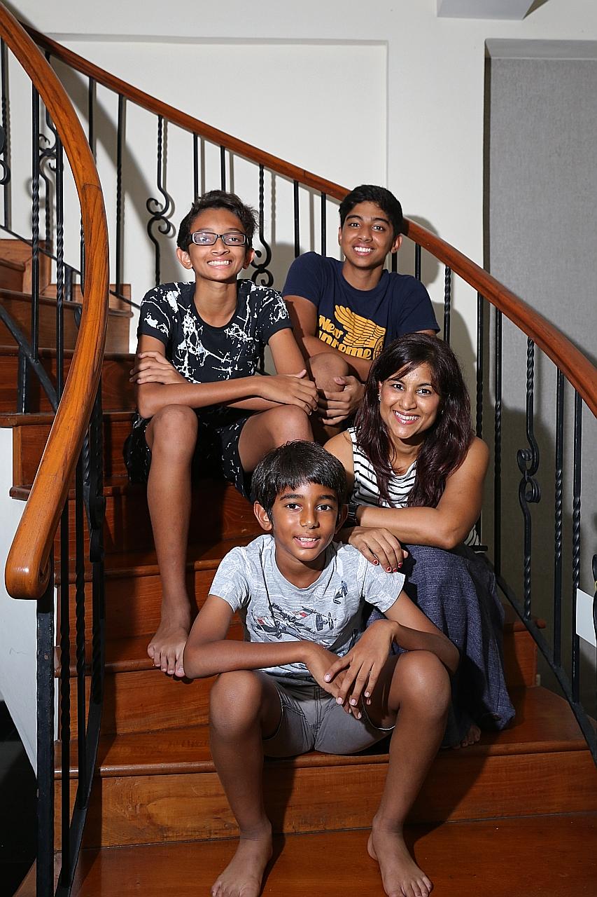 Mrs Denise Ponnampalam-Vijayan with her son Divyan Luke Vijayan, 15 (top left), who had been exempted from taking Chinese. With them are another two of her children, Ashwin Mark Vijayan (in navy blue), 17, and Nishanth John Vijayan, 11.