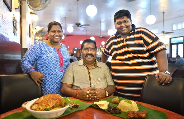 Mr V Maheyndran (centre) with his daughter Nagajyothi Mahendran and son M Veerasamy, who both run Samy's Curry.