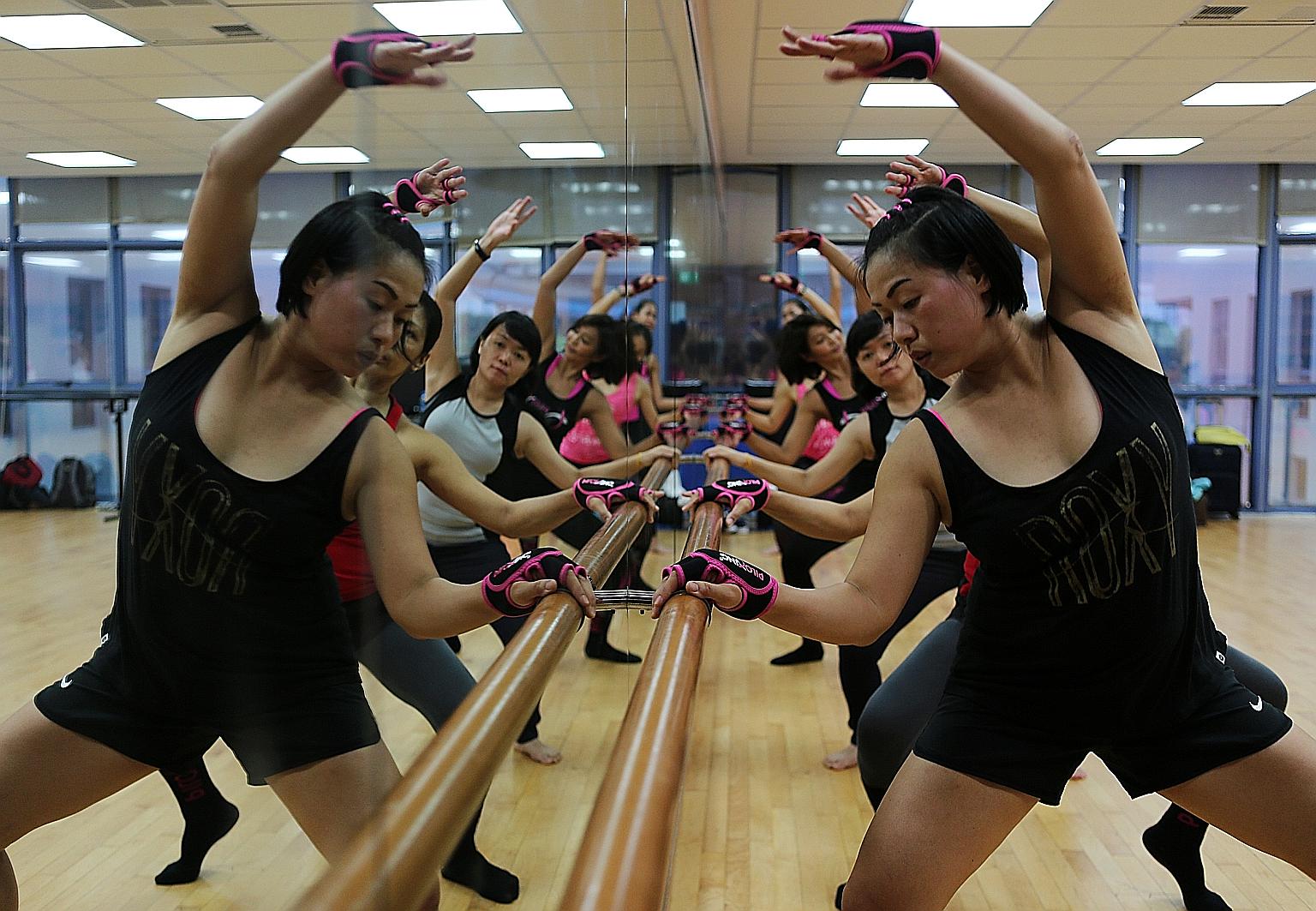 In Piloxing Barre, participants engage more of their muscles by using the barre to bend lower or raise their legs higher.