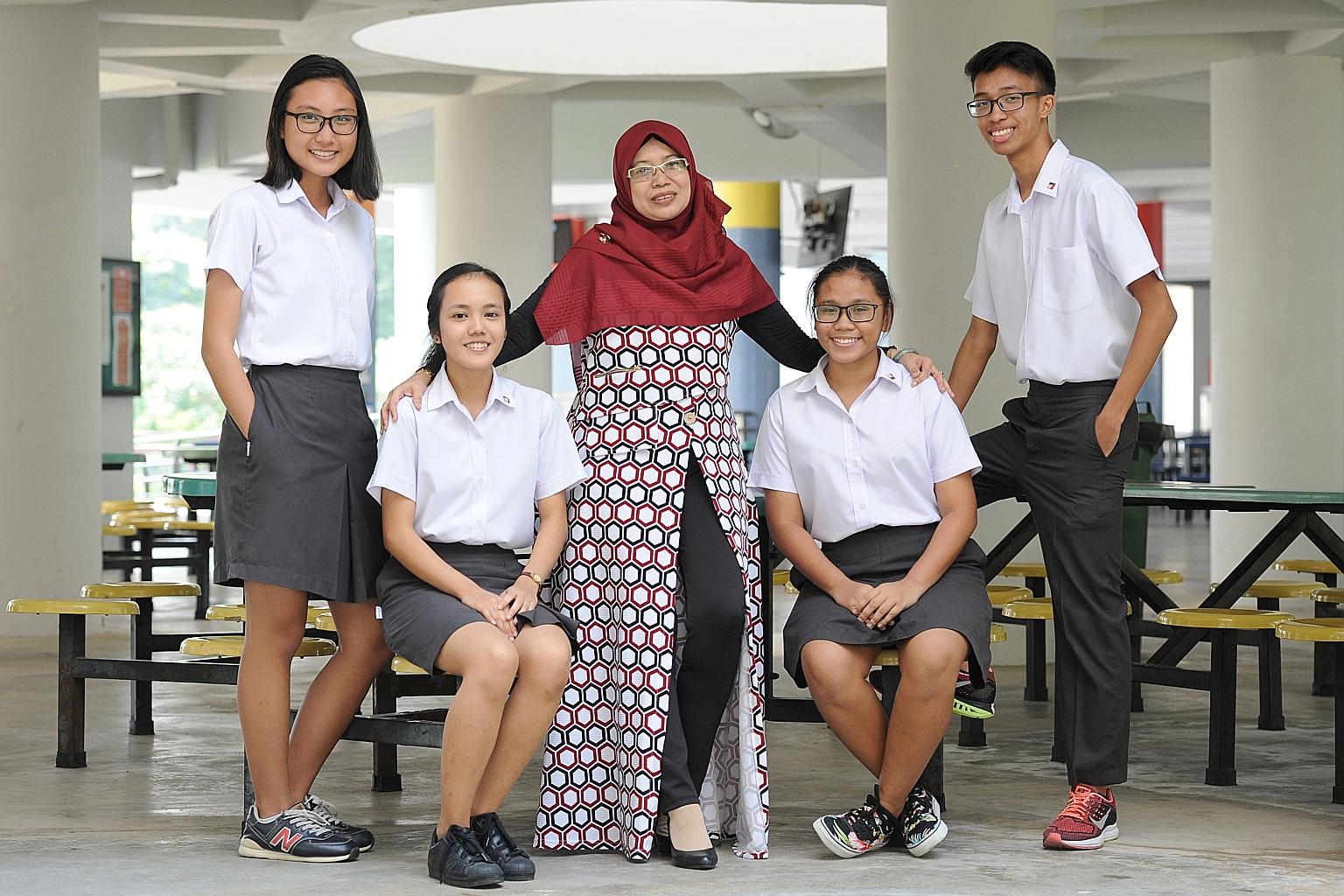 Madam Zainun Hashim, coordinator for the Malay Language Elective Programme, with four Pioneer Junior College students in the programme. They are (from left) Hanisah Syahirah Mohd Yani, 18; Nur Salina Rahmat, 19; Siti Rezkiah Mohd Radzelee, 17, and Mi