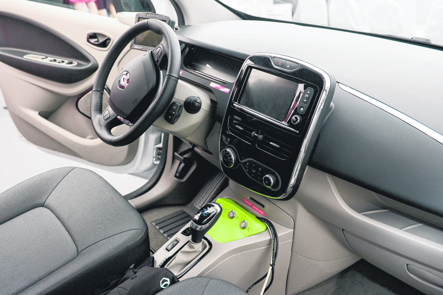 Start-up nuTonomy's self-driving Renault Zoe (left) is one of the vehicles that will be tested at the centre's circuit for autonomous vehicles.