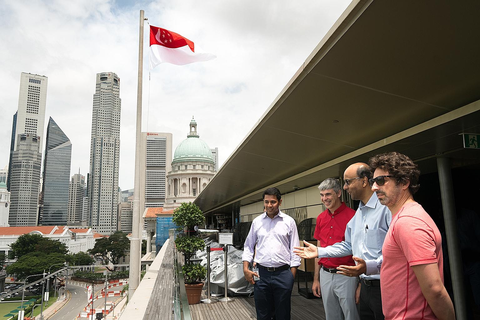 Mr Page (in red shirt) and Mr Brin (at right in picture) at the National Gallery with Mr Tharman. With them is Mr Caesar Sengupta (far left), vice-president of product management at Google.
