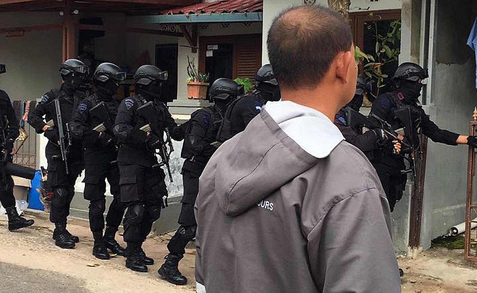 Indonesia's elite counter- terrorism unit Densus 88 carrying out a raid in Batam. Six members of a little-known terror cell called Katibah GR, or Cell GR, were arrested yesterday.