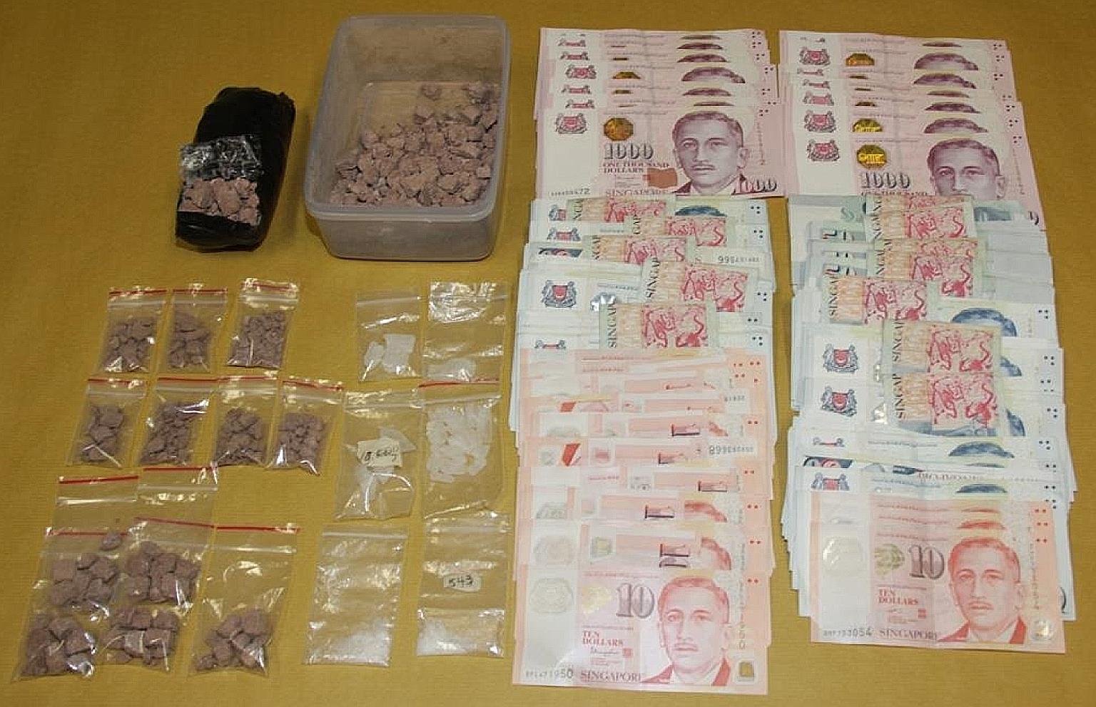 Heroin, Ice and cash seized on Thursday, when CNB officers arrested three suspected drug offenders and seized about 620g of heroin and 40g of Ice, with an estimated street value of more than $48,000.