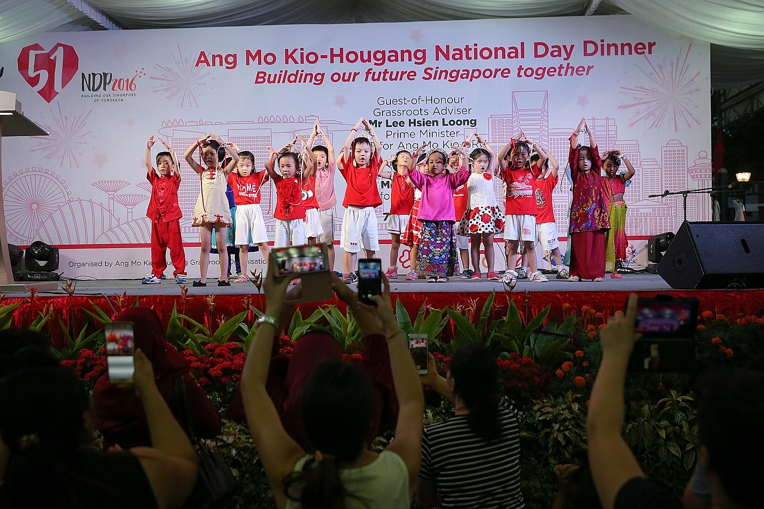 Children performing at yesterday's Ang Mo Kio-Hougang National Day Dinner, attended by PM Lee and his fellow MPs, as well as around 1,300 residents. His National Day Message, recorded at the newly opened Safra clubhouse in Punggol, will be broadcast