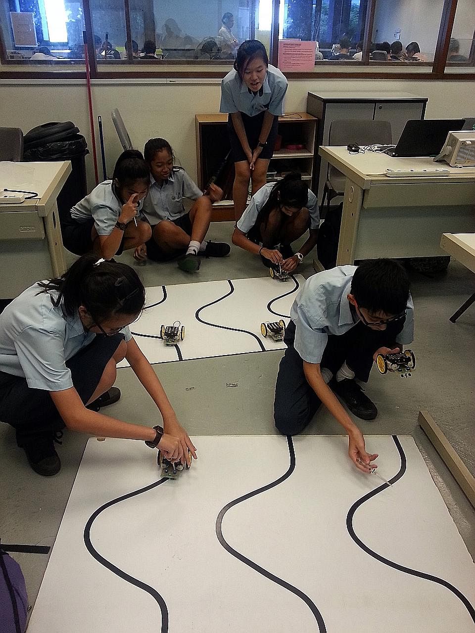 Hong Kah Secondary students testing out their car models during an advanced elective module on electronic product design held at Ngee Ann Polytechnic.