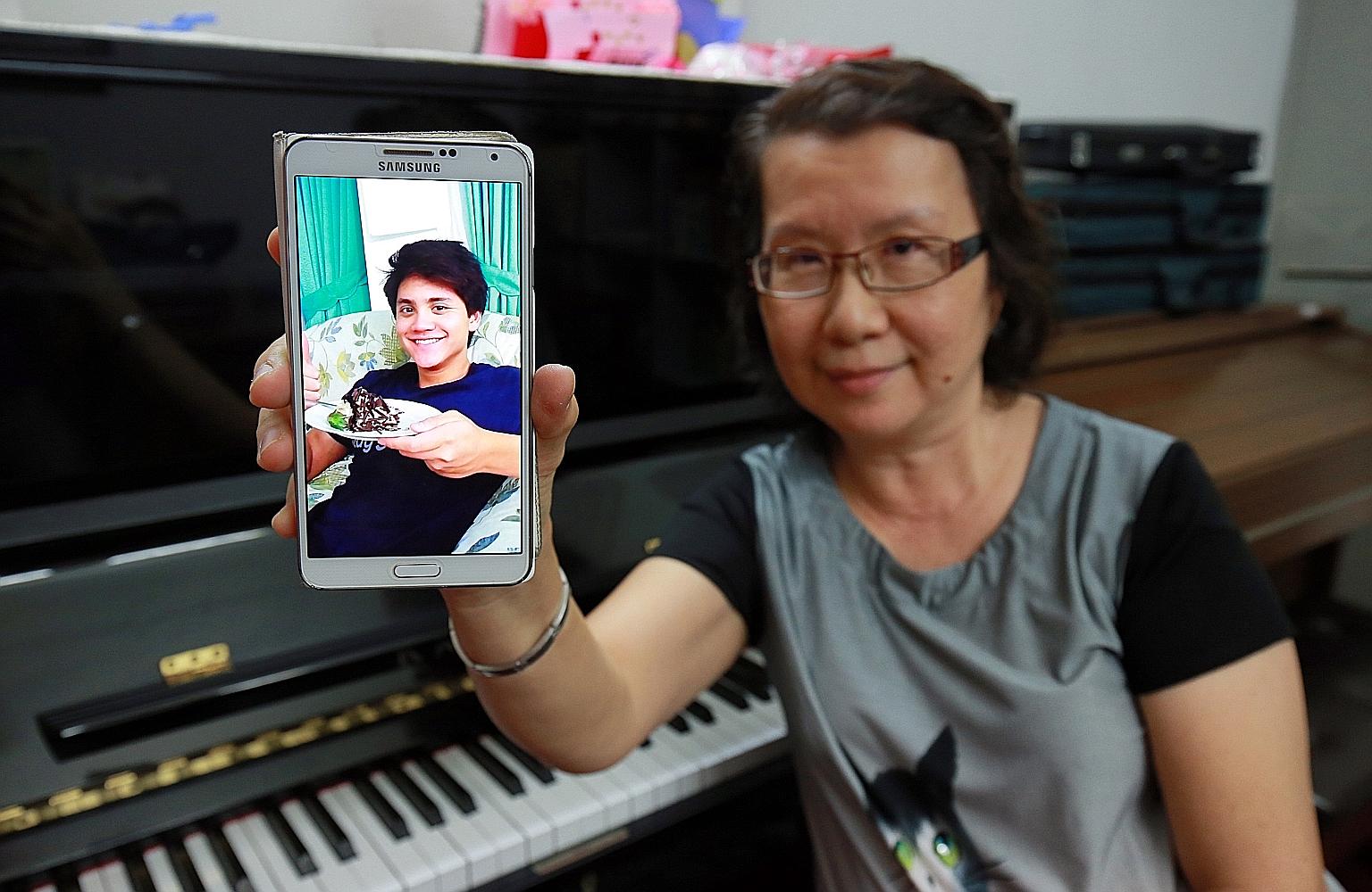 Ms Yim with a photo of her nephew. The music teacher said his talent and discipline was visible from a young age and he never missed a swim even on holiday in Ipoh as a child. Although the whole family was not able to be in Rio de Janeiro to cheer hi