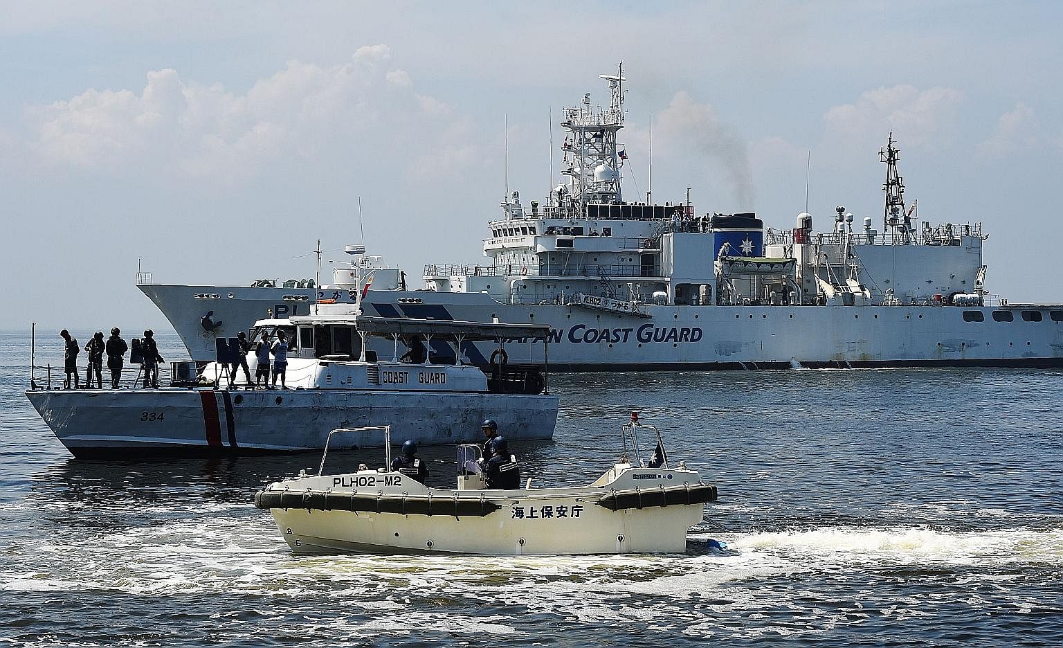 Japan Coast Guard vessels at an annual joint anti-piracy exercise in waters off Manila Bay on July 13 - a day after an arbitral tribunal ruled that China has "no historical rights" in the South China Sea.