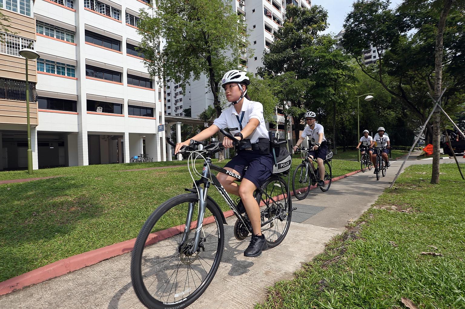 Volunteer Special Constabulary officers patrolling a housing estate in Toh Guan. The AGO said in its report that the increase in the allowance for the part-time officers was higher than what was stipulated by law.
