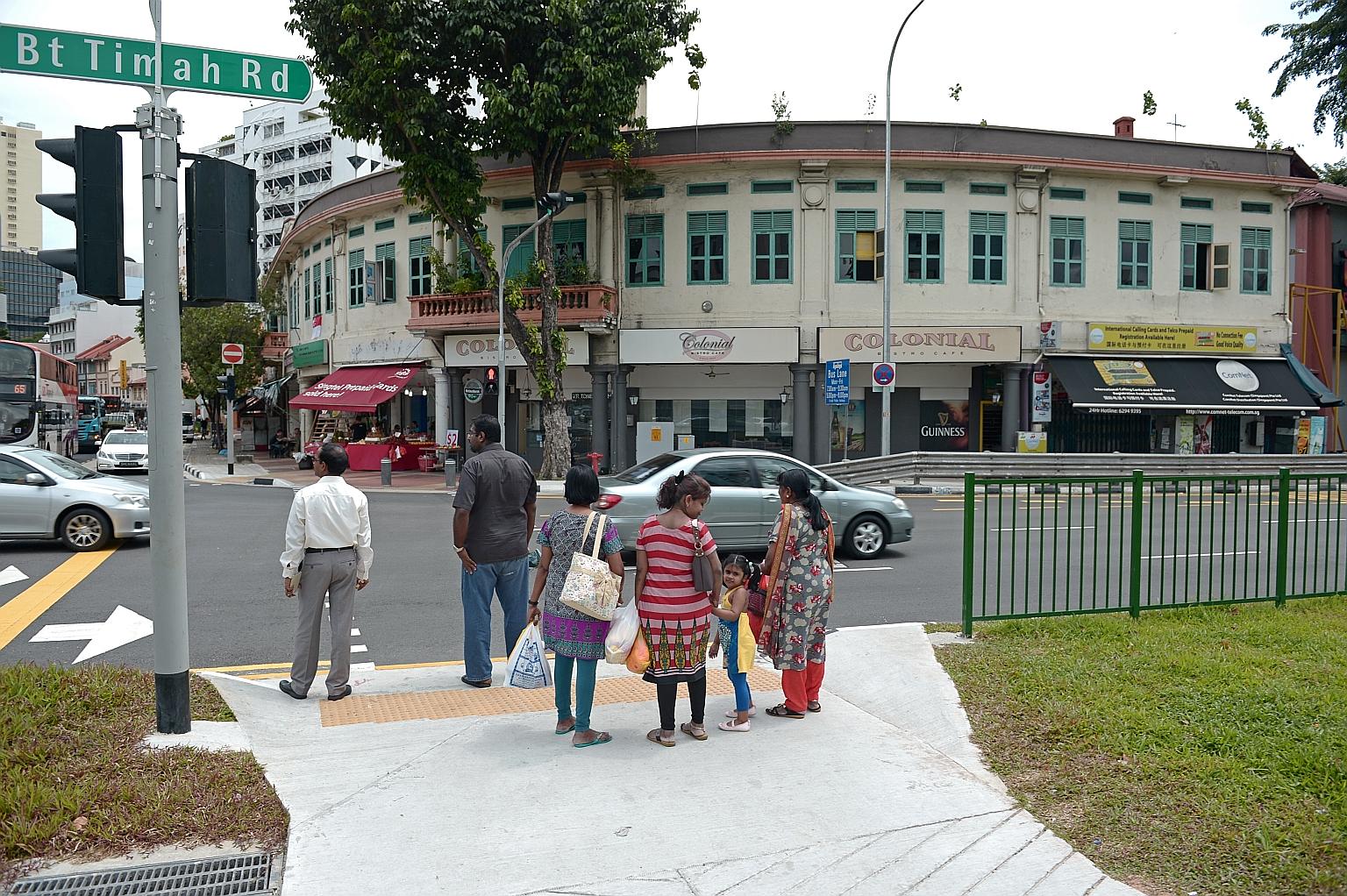 The affected units - currently occupied by a mama shop, Colonial Bistro Cafe and part of a fruit shop - are along Ellison Building's curved facade. LTA said it will rebuild and reinstate the affected part to its original architectural design once con
