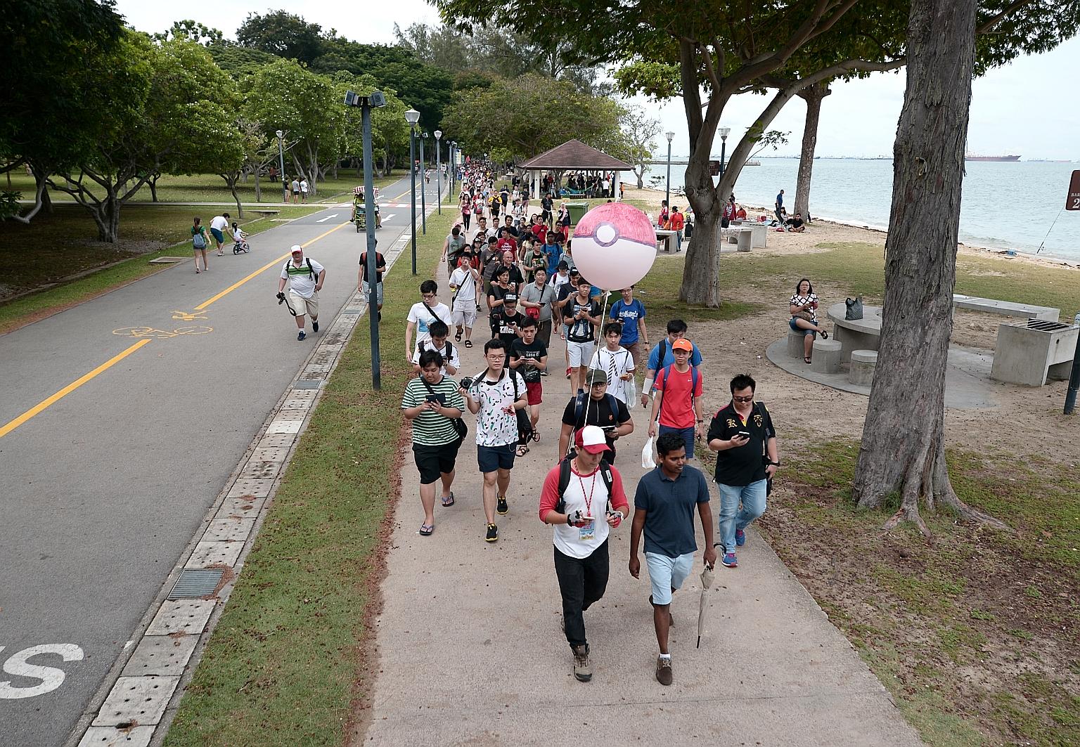 The mass walk yesterday started from East Coast Park and continued for about 8km to Gardens by the Bay and Marina Barrage. The route passed 53 PokeStops and eight "gyms", the organiser said.