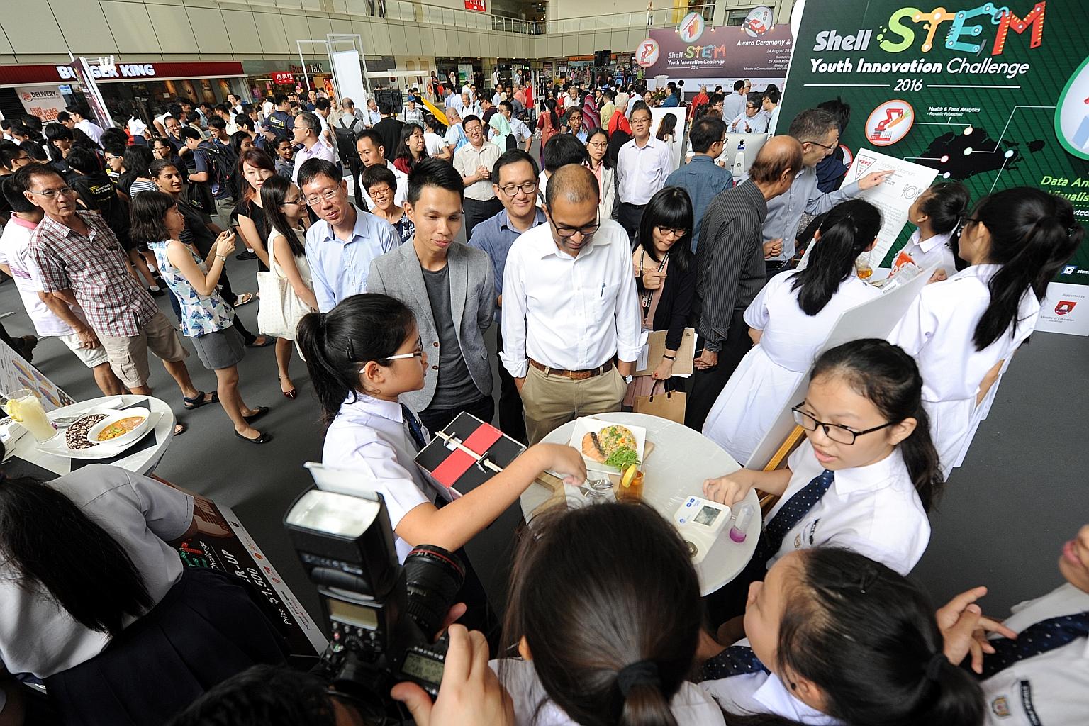 What do barley fried rice and chamomile tea have in common? They are healthier meal options that Dunearn Secondary School students (foreground) designed for the elderly. The students designed the meal based on the nutritional levels of different type