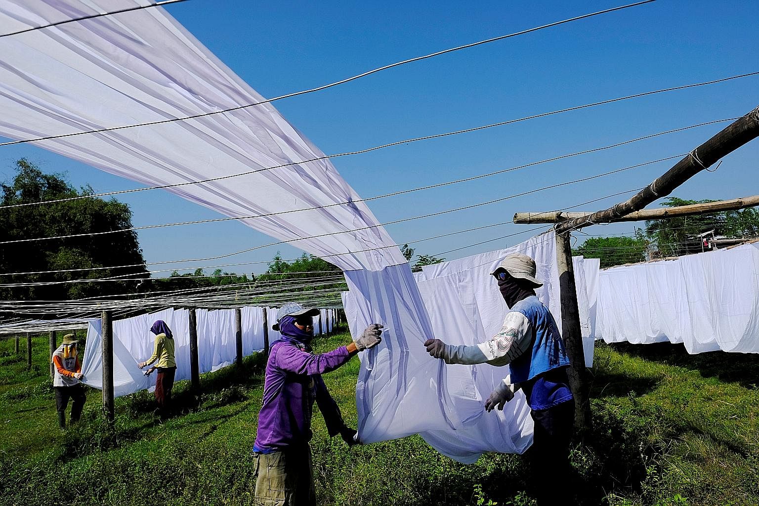 Workers at a textile factory in Solo, Central Java. Indonesia's labour-intensive industries such as textile and garment-making have been experiencing negative growth since the last quarter of 2014, while ceding ground to a more competitive Vietnam, w