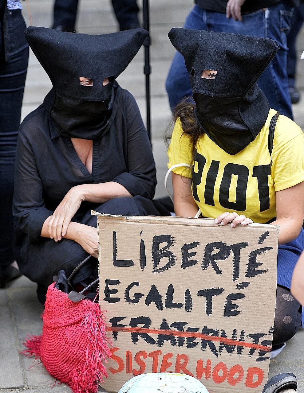Participants of the Wear What You Want Beach Party protest outside the French Embassy in London. The protest against the burkini ban was held to show solidarity with Muslim women in France.