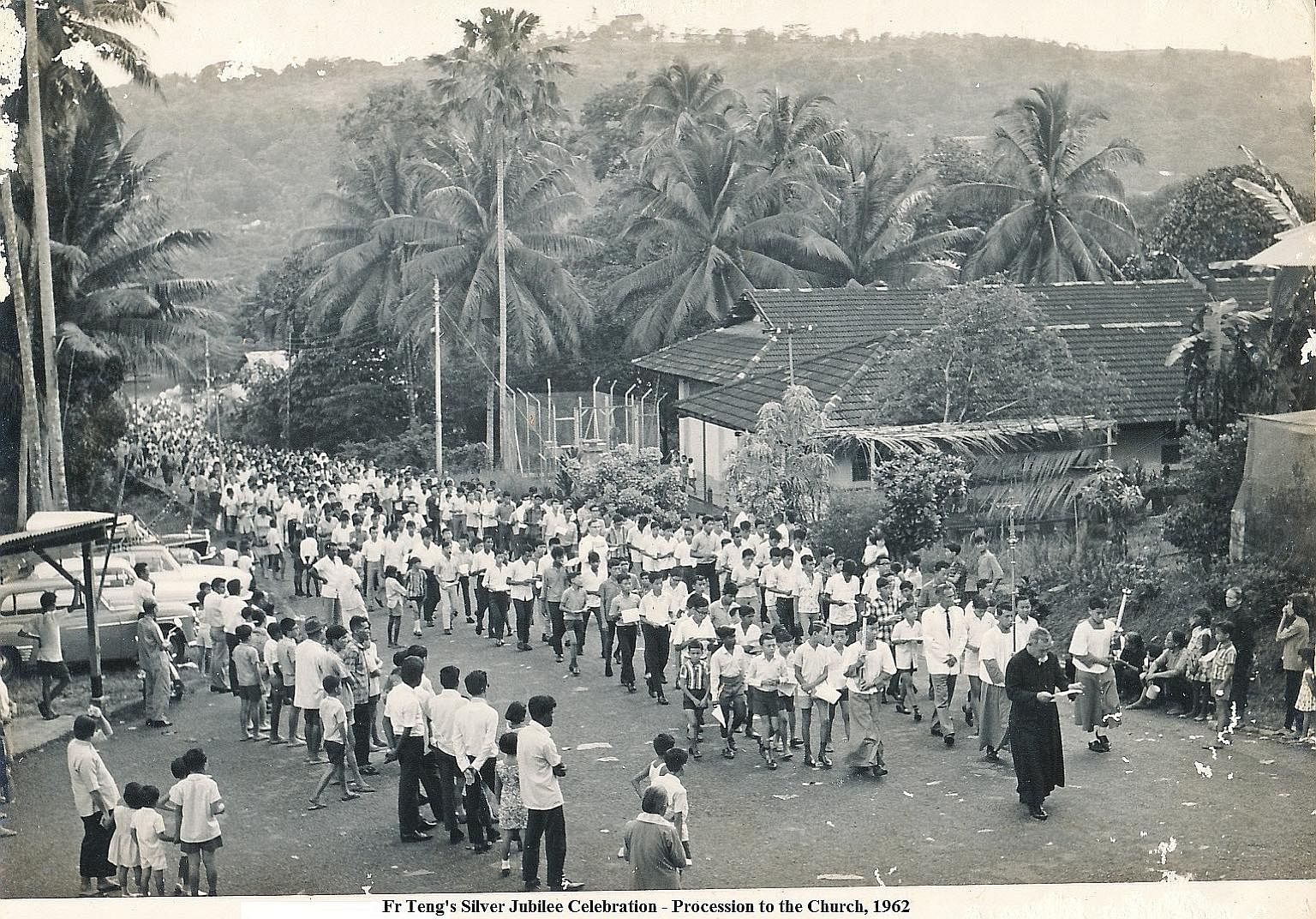 Father Teng leading parishioners in a procession to the church in 1962 to celebrate his Silver Jubilee.