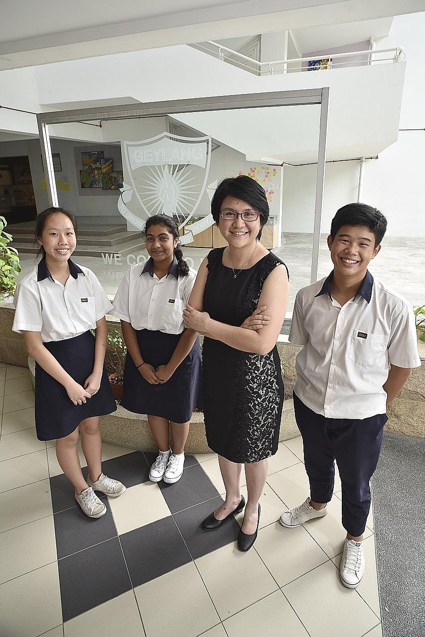Geylang Methodist Secondary School senior mathematics teacher Wendy Wong with students (from left) Ng Shu Wei, Raziya Begum and Ulysse Yeo, all 15. Changing students' mindsets is no easy task, but Ms Wong says she does not give up easily.