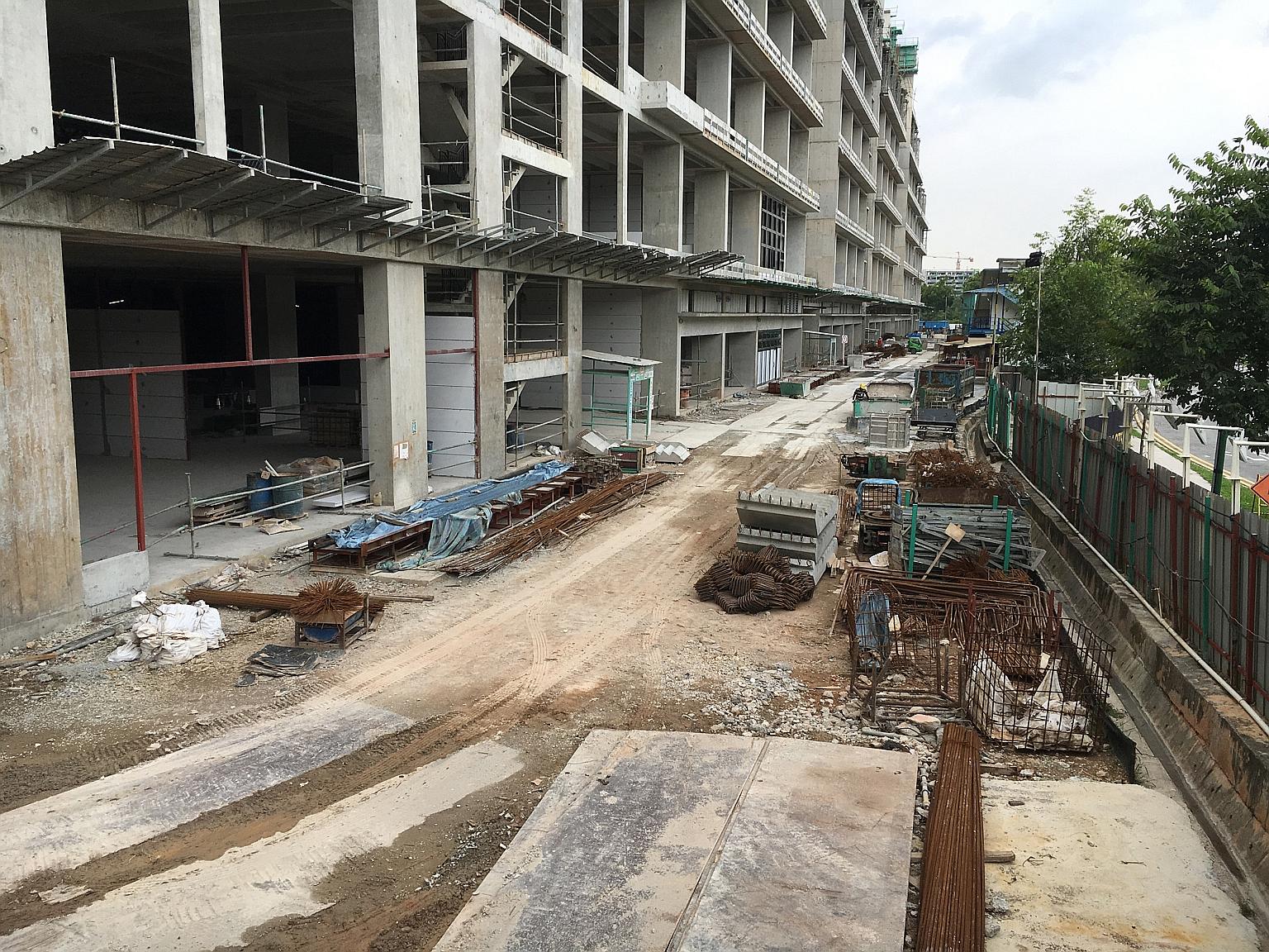 The Mega@Woodlands construction site for an eight-storey industrial factory development. A formwork panel fell seven storeys over the edge of the building, taking the 33-year-old construction worker with it. He was pronounced dead at the scene.
