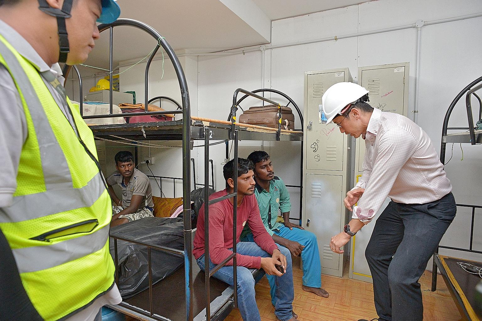 Mr Teo talking to workers in the dormitory at the Sims Urban Oasis construction site yesterday. Thirty-seven cases of Zika were discovered over the weekend to have originated from the site, and another two surfaced on Monday. A stop-work order was is