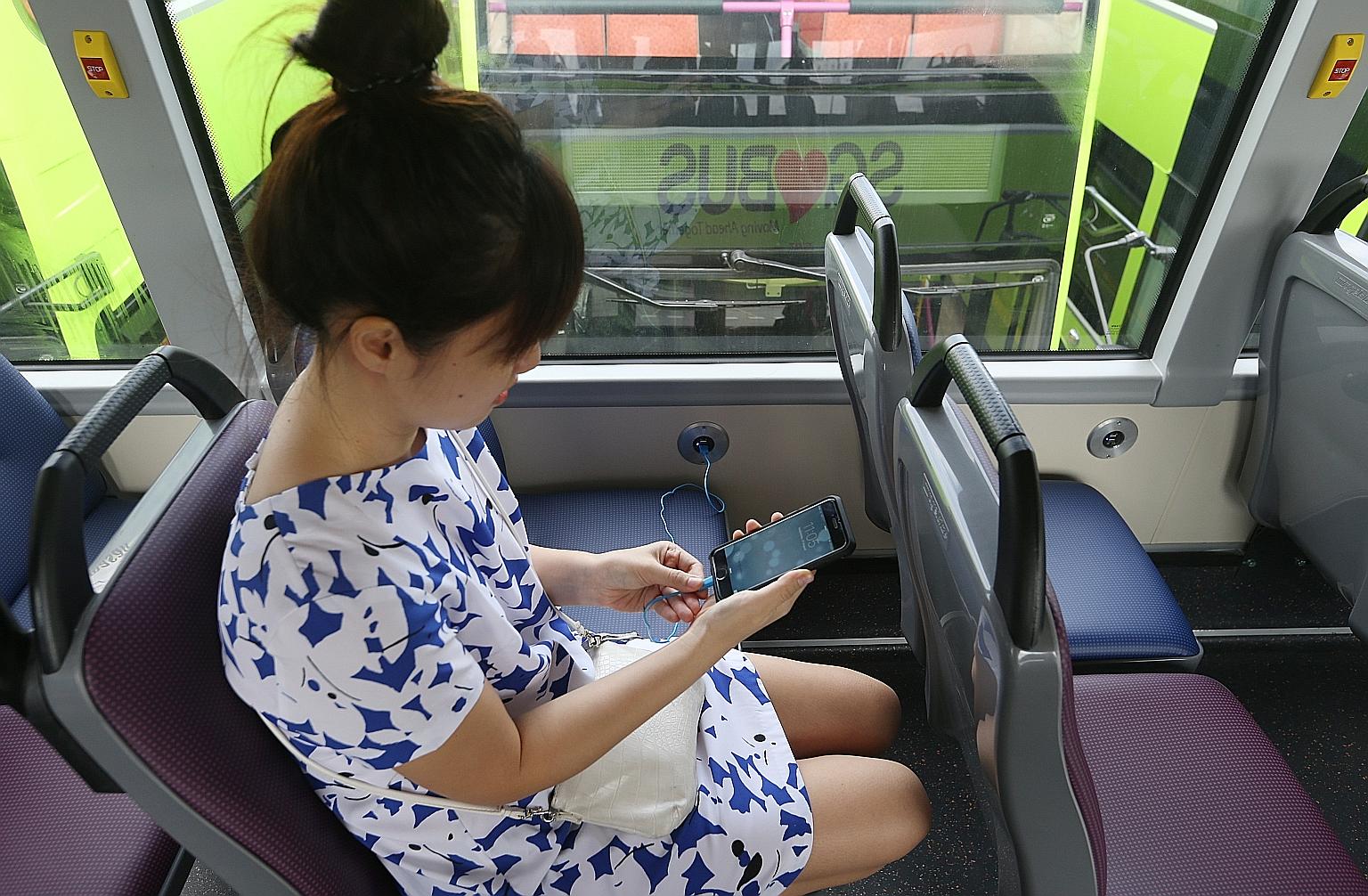 The 10 buses will begin running on five of SMRT's services from today. Commuters will have to use their own charging cables.