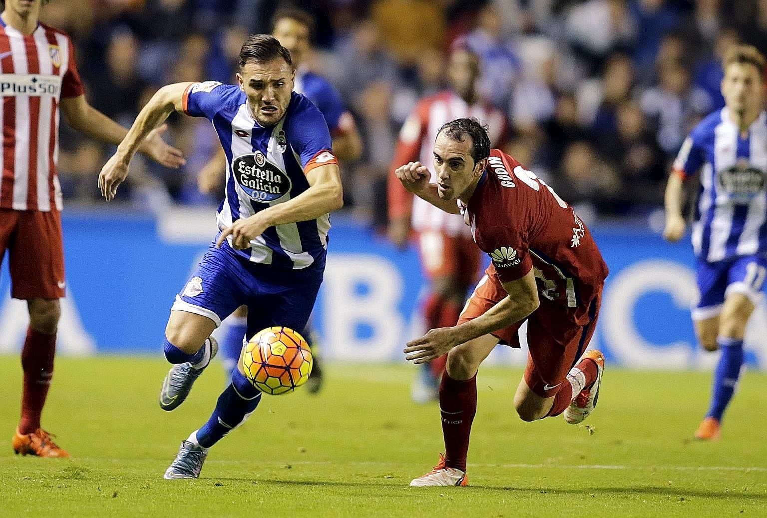 Deportivo Coruna's Lucas Perez (left) fighting for possession against Atletico Madrid's Diego Godin last year. EPL clubs do not always attract the very best Spanish players.