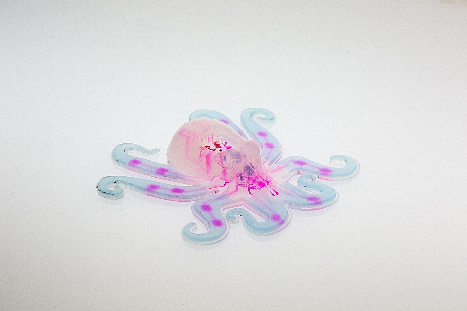 Meet the octobot, an entirely soft, autonomous robot. A pneumatic network (pink) is embedded within the 3D-printed octobot's body and hyperelastic actuator arms.