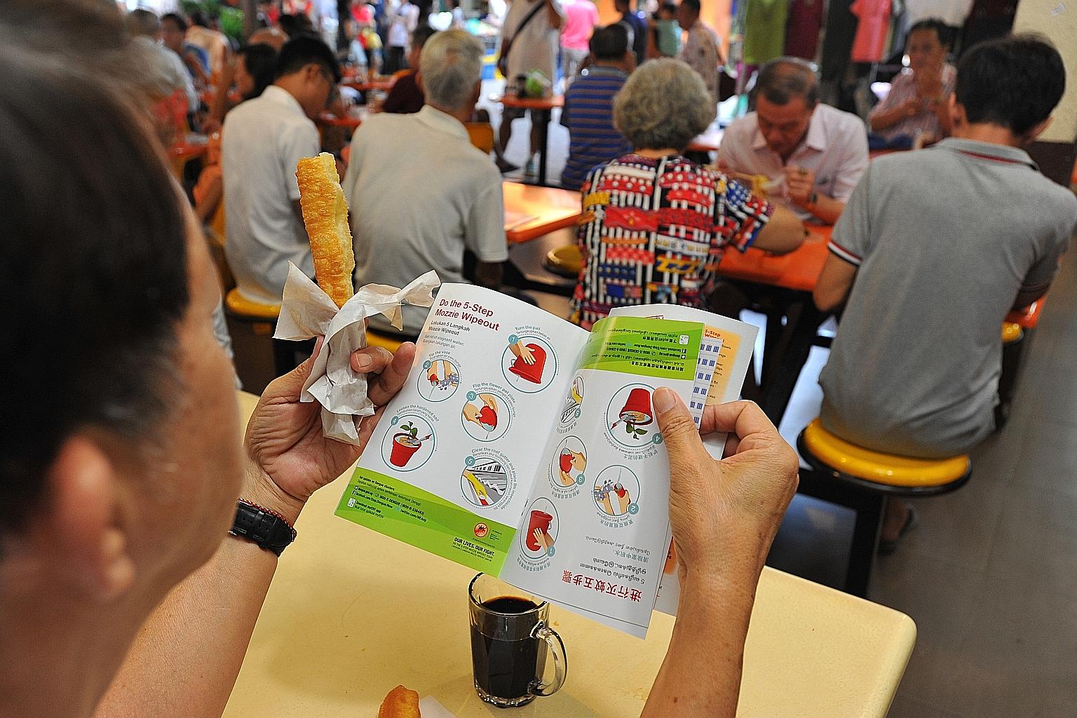 At an outreach event in Tampines yesterday, MPs handed out Zika fliers.