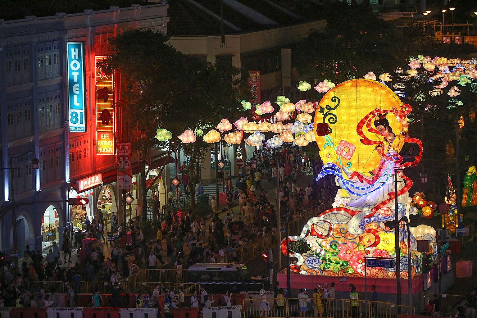 The streets of Chinatown turned into a dazzling display of lights last night as 900 lanterns were lit to mark the start of the month-long Mid-Autumn Festival celebrations. This year's centrepiece is a 12m-tall sculptured lantern featuring mythical mo