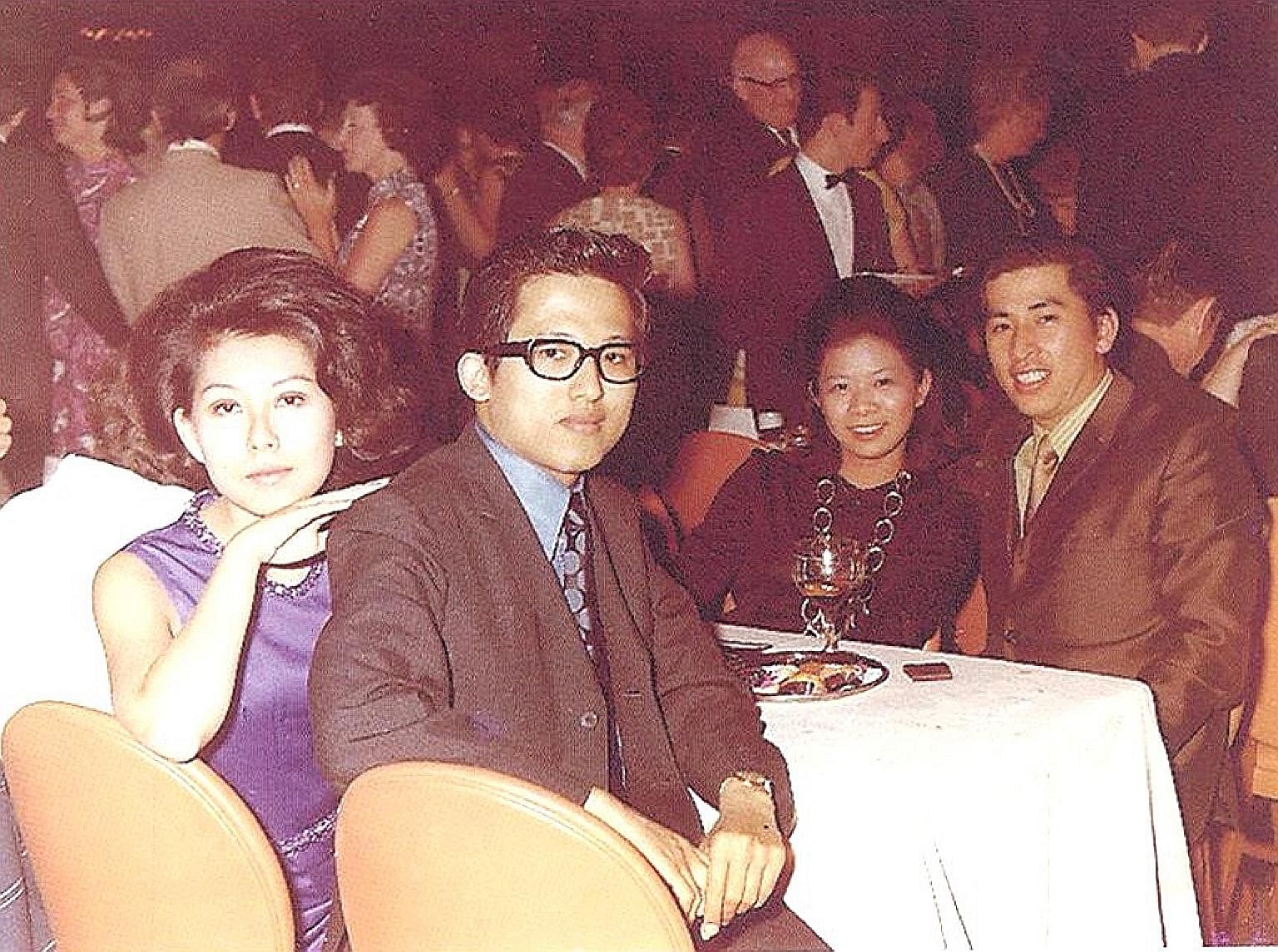 My life so far: Mr Kwek Leng Beng with his wife, Cecilia Kok (both above), in London in 1970; and at the opening of Hong Leong Finance Lavender Street branch in 1967.