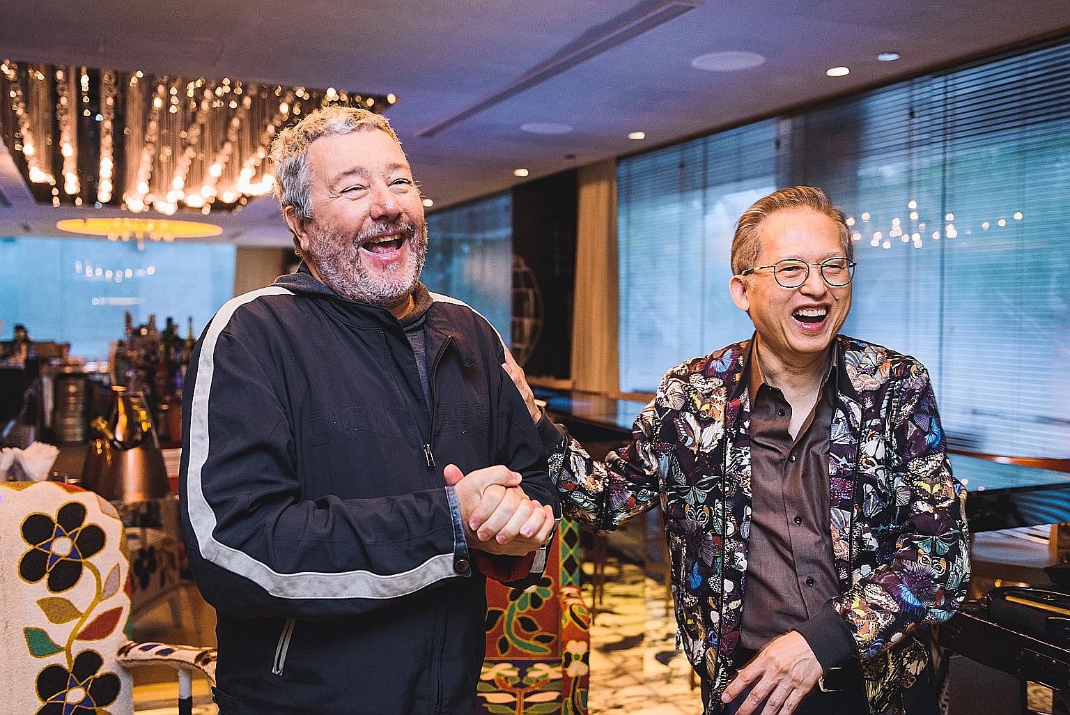 My life so far: Mr Kwek with French designer Philippe Starck (above), who designed the M Social hotel; and with former British prime minister Margaret Thatcher in the 1990s.