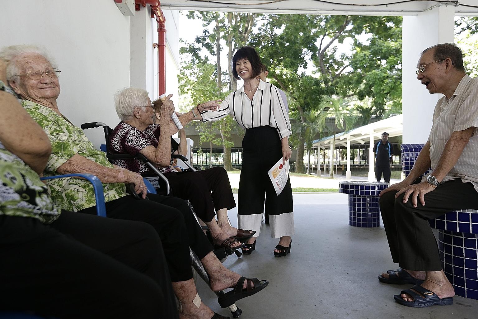 Dr Khor speaking to elderly residents in Paya Lebar Way about the Zika virus last week. Zika cases in Singapore have continued to rise, with another 27 detected by noon yesterday.