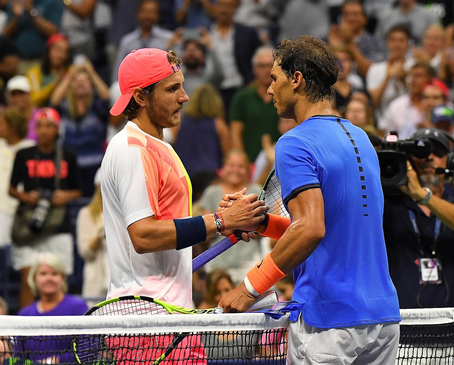 Underdog Pouille (left) beat Nadal in their fourth-round encounter at Flushing Meadows on Sunday.