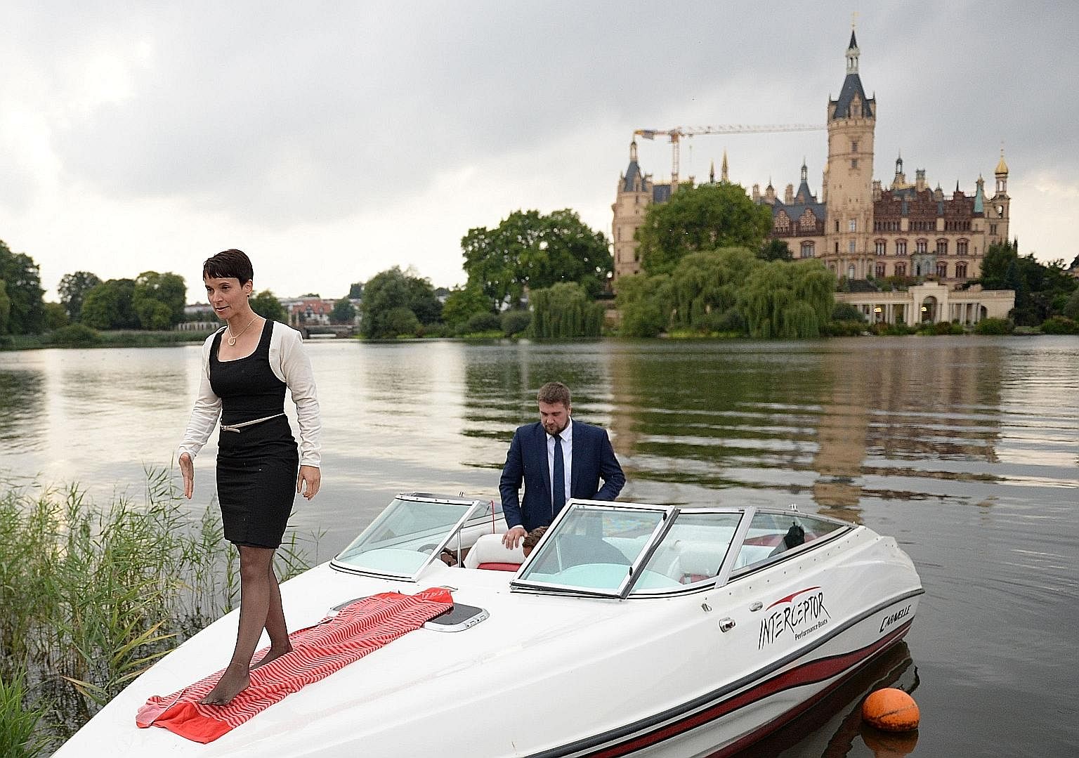 Under the leadership of Ms Frauke Petry, seen here arriving on a boat for an election results party on Sunday in Schwerin, north-eastern Germany, the populist AfD has shifted its emphasis to anti-immigration questions - and has thrived.