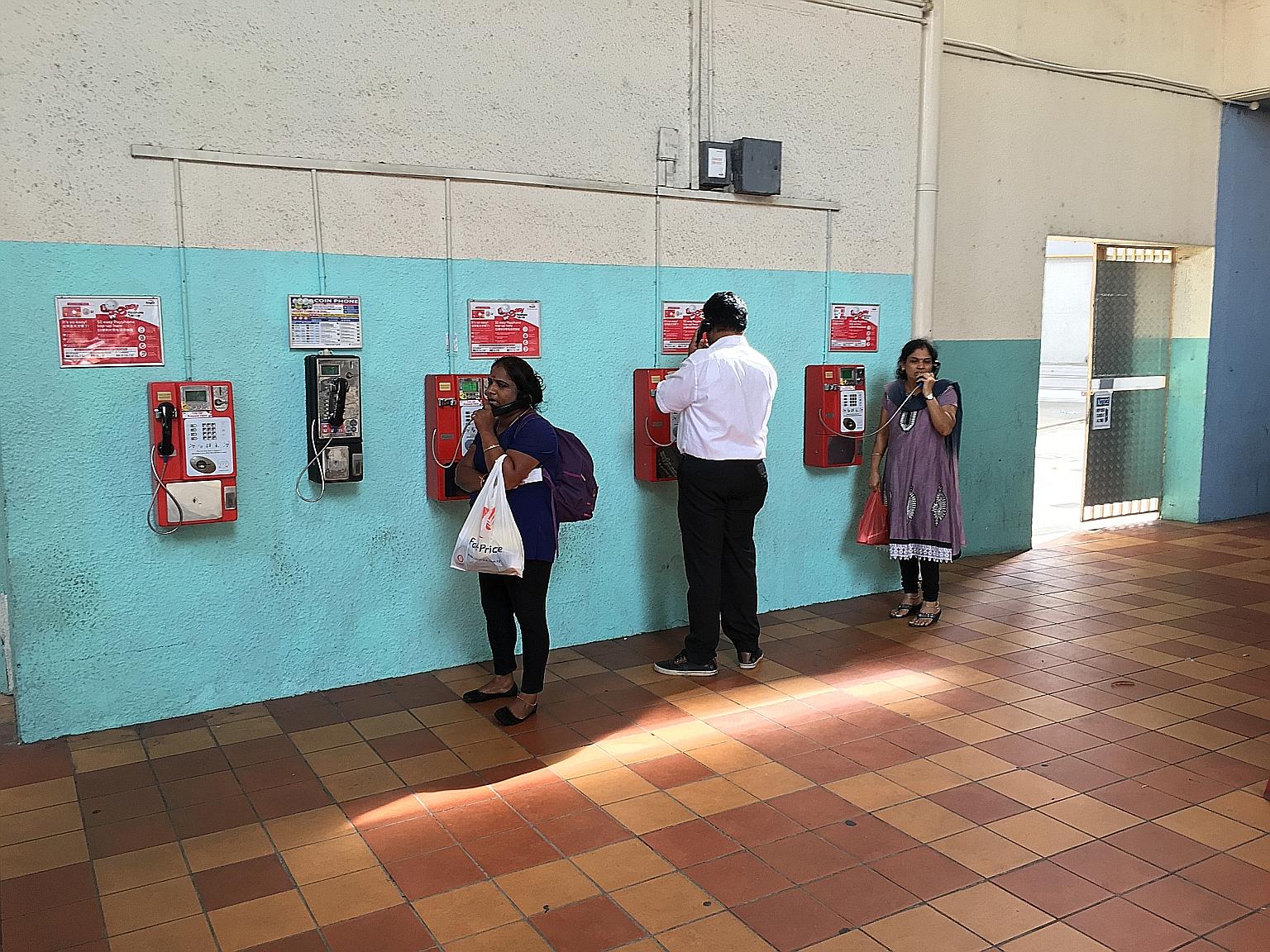 About 25 people were seen using the payphones in Tekka Centre in five hours. Some needed a payphone because the batteries in their mobile phones had run out, while others had forgotten to take their phones.