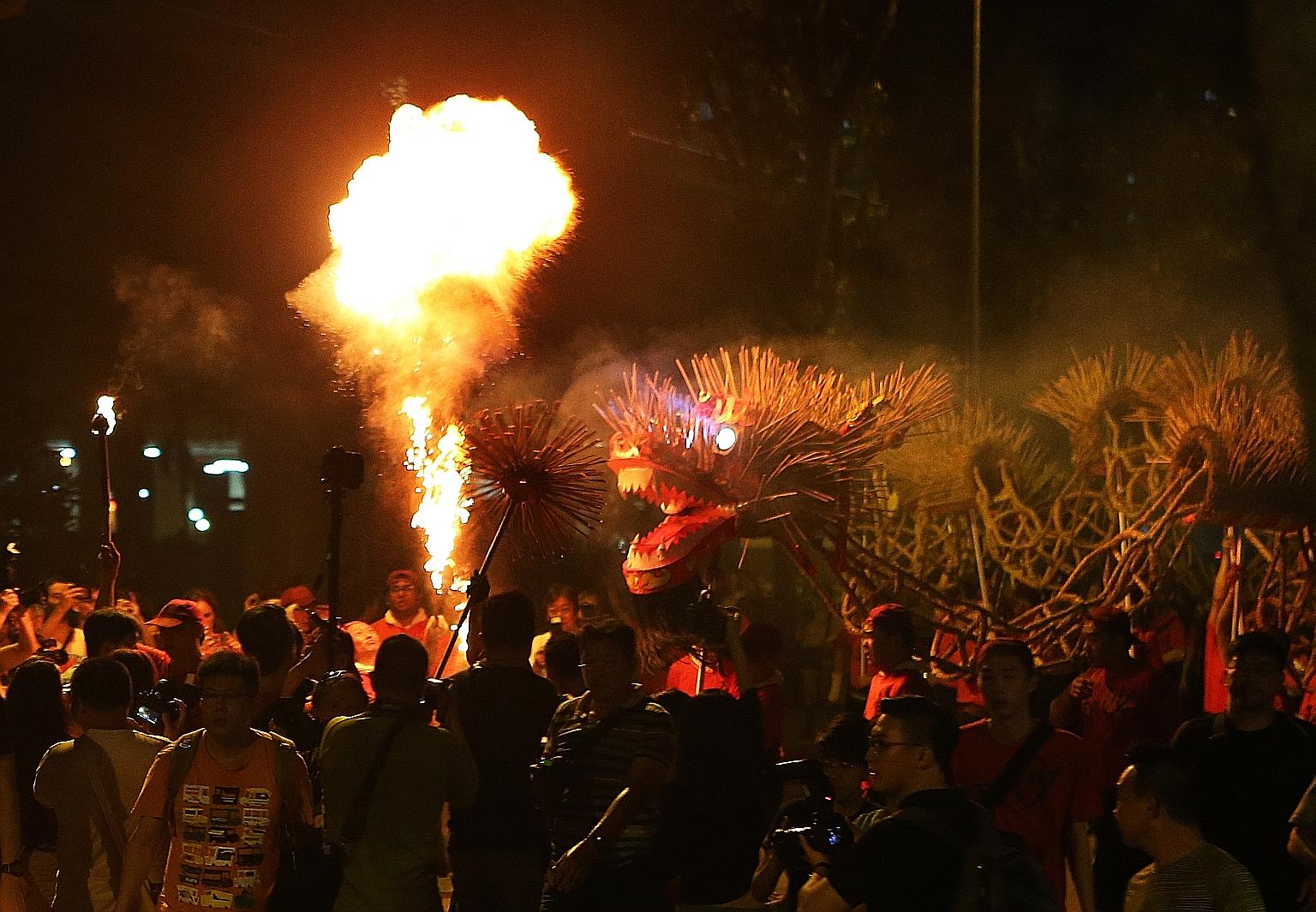 A 45m-long fire dragon danced its way through the smoke last night to celebrate the 150th anniversary of Sar Kong Mun San Fook Tuck Chee temple in Kallang. Weighing 100kg, the plaited straw dragon was filled with lit joss sticks and wielded by the te
