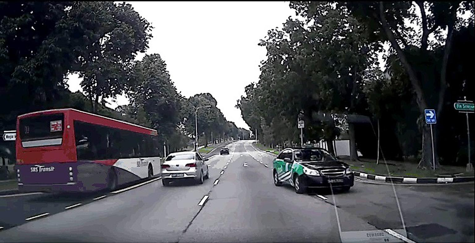 A screengrab from a video clip showing an SMRT taxi going against traffic in Sims Avenue East. The taxi company said that it has since taken action against the errant driver.