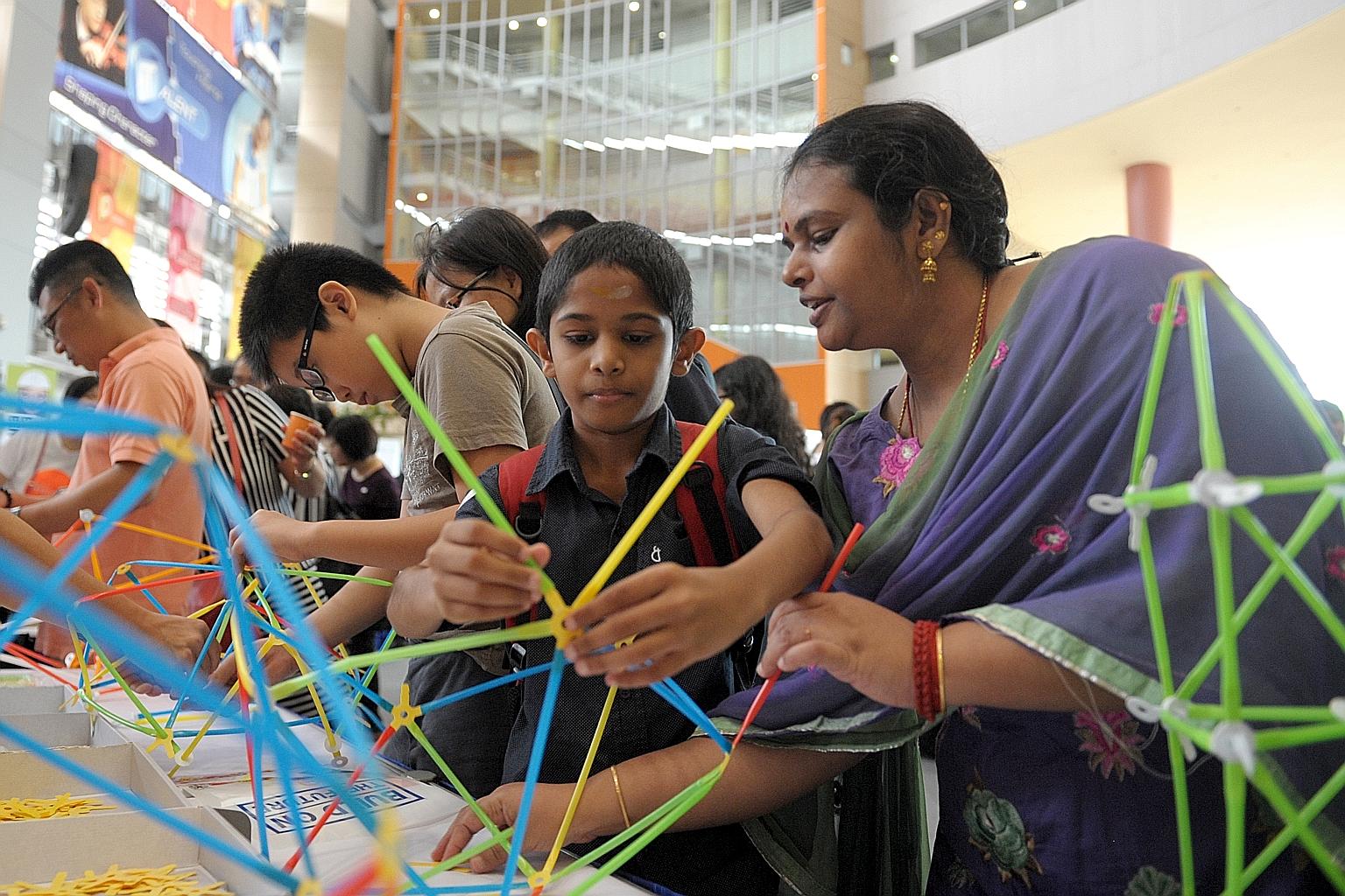 Participants at the Education and Career Guidance (ECG) fair at Nanyang Polytechnic yesterday. The MOE has been giving more such guidance to students and parents. Last October, it announced that it would increase the number of ECG counsellors in scho