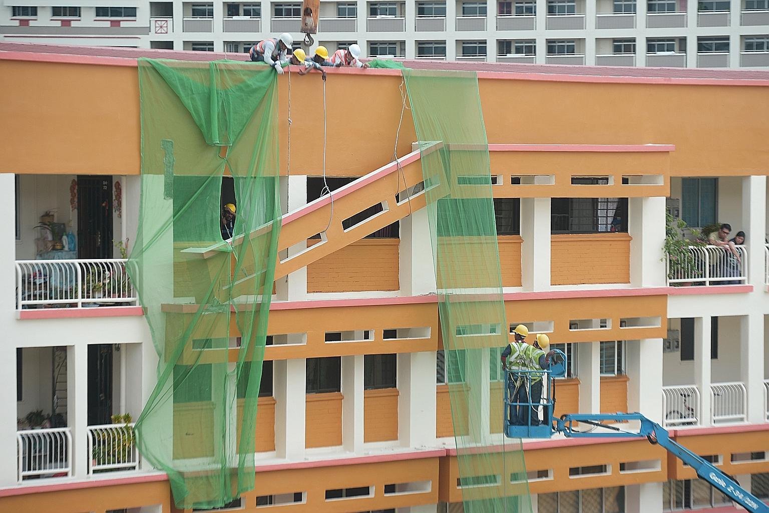 A concrete sunshade was partially dislodged and left balancing on the exterior of Block 201E, Tampines Street 23 yesterday morning. One end of the sunshade, on the fourth floor of the block, crashed down onto a sunshade on the floor below. While the