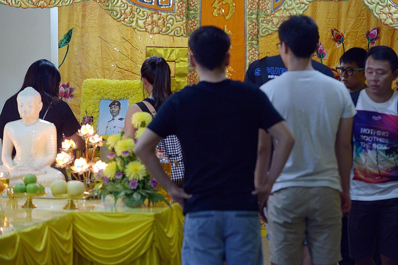Visitors paying their respects at Mr Wong's wake in Jurong East yesterday. He was travelling in a convoy with five other riders to Fraser's Hill in Malaysia on Saturday morning when the accident happened.