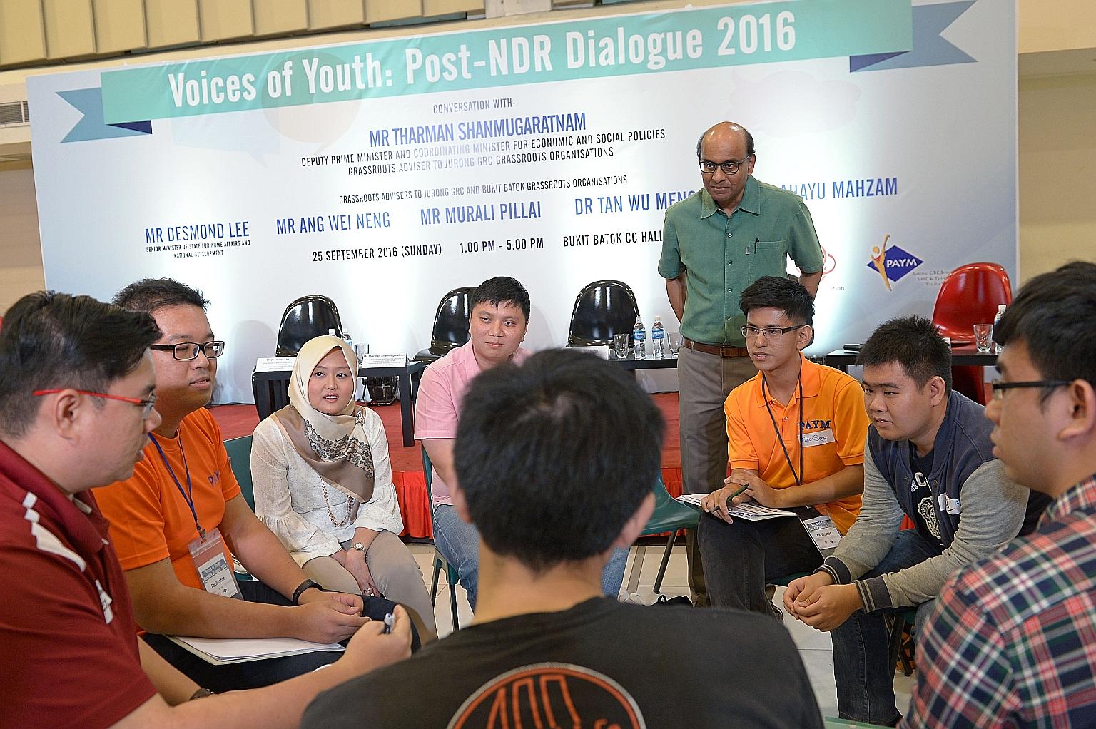 Mr Tharman and Jurong GRC MP Rahayu Mahzam (third from left) at a small group discussion with young people yesterday. After the discussions, participants took part in a dialogue with MPs from Jurong GRC and Bukit Batok, where they discussed issues ra