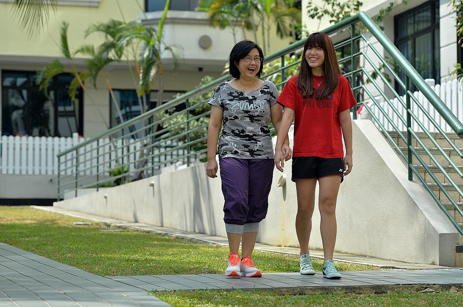Breast cancer survivor Lim Loo See, 55, with her daughter Charmian Yeo, a 26-year-old student.