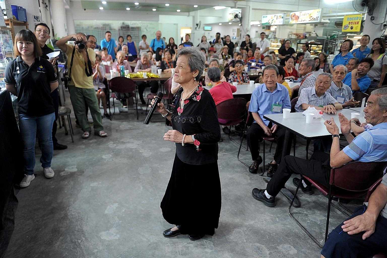 Madam Ho singing at the karaoke competition held last month at Dignity Kitchen, a hawker training school for people with disabilities, and the disadvantaged.
