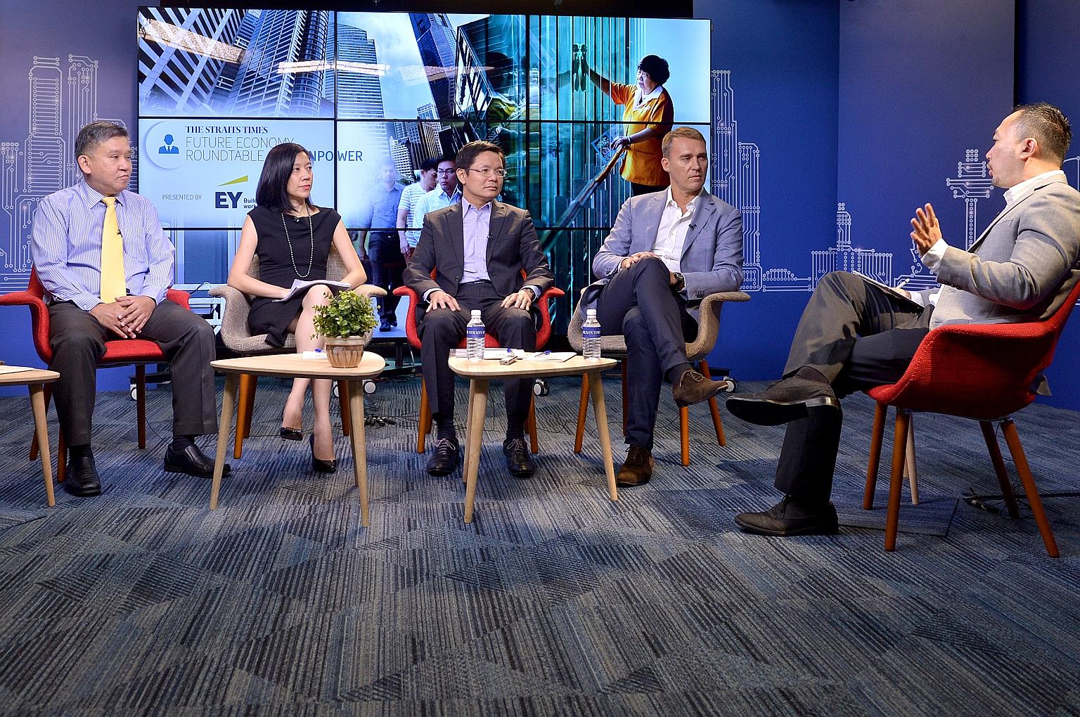 The Oct 20 forum is the culmination of seven roundtables hosted by ST this year, such as the July 4 one above with (from left) ST senior correspondent Toh Yong Chuan; EY partner and Asean People Advisory Leader Dilys Boey; CEO of Workforce Developmen