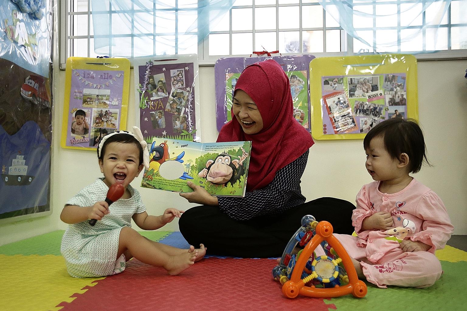Ms Intan cares for infants like 16-month-olds Anna Aisha Khairul Anuar (left) and Wong Min En at My First Skool in Woodlands, which already closes on Teachers' Day.
