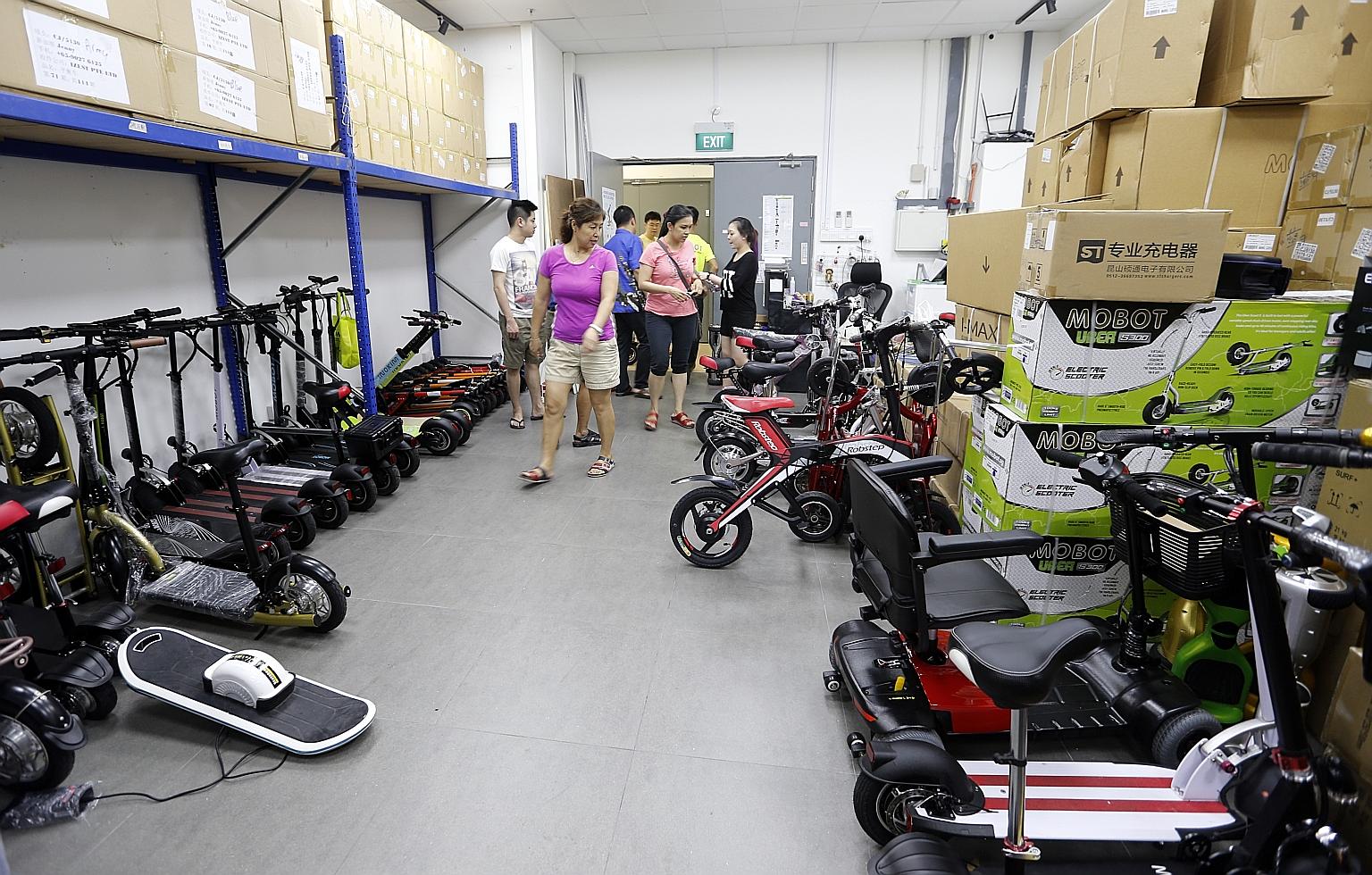 An array of mobility devices at Mobot's showroom in Ubi. The retailer says it sells more than 400 e-scooters a month, a 30 per cent increase since stricter e-bike rules took effect last December.