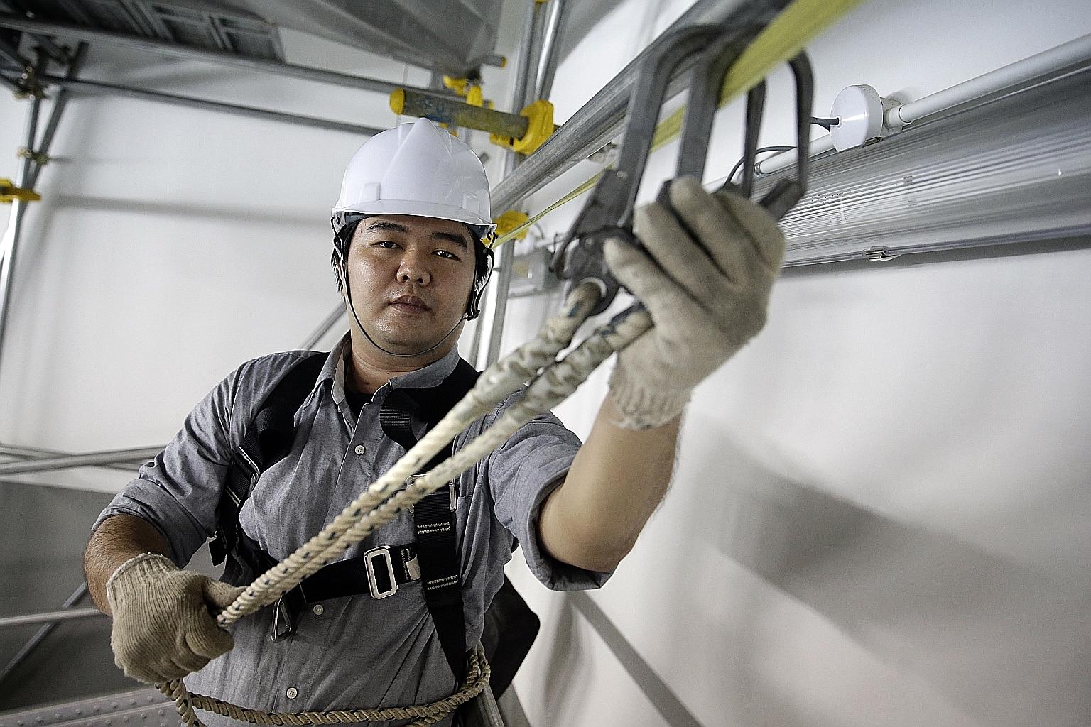Workplace safety and health trainer Han Wenqi believes safety officers should be empowered to order work to stop at once when they see something dangerous on site.