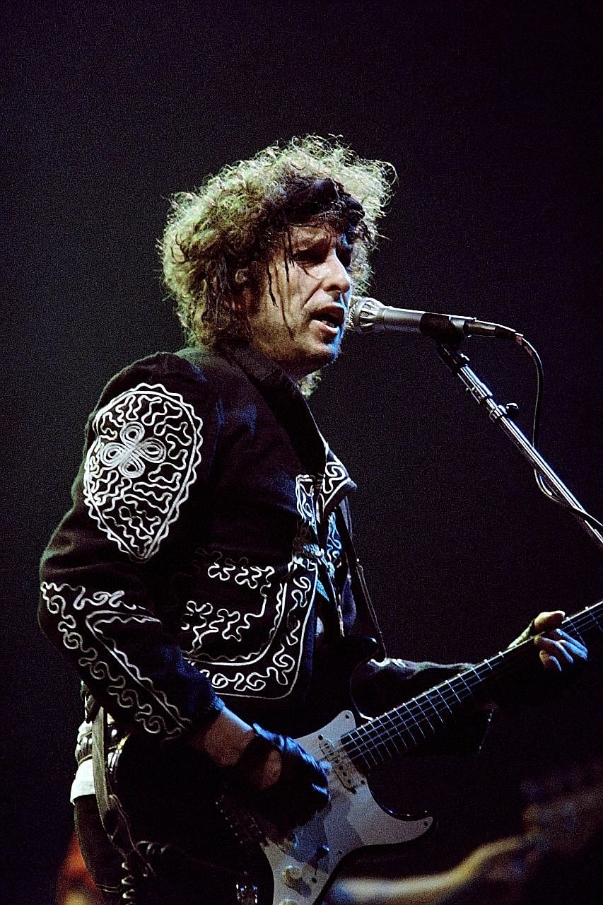 US folk singer-songwriter Bob Dylan performing in Paris on Oct 8, 1987. The 75-year-old received the prize "for having created new poetic expressions within the great American song tradition".
