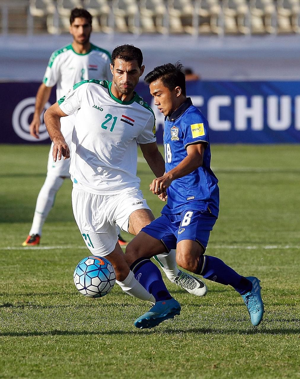 Iraq's Saad Abdulameer closing in on Thailand's Chanathip Songkrasin during their World Cup qualifier in Teheran last Tuesday. Thailand have lost all four games so far and their chances of making the 2018 Finals in Russia are slim.