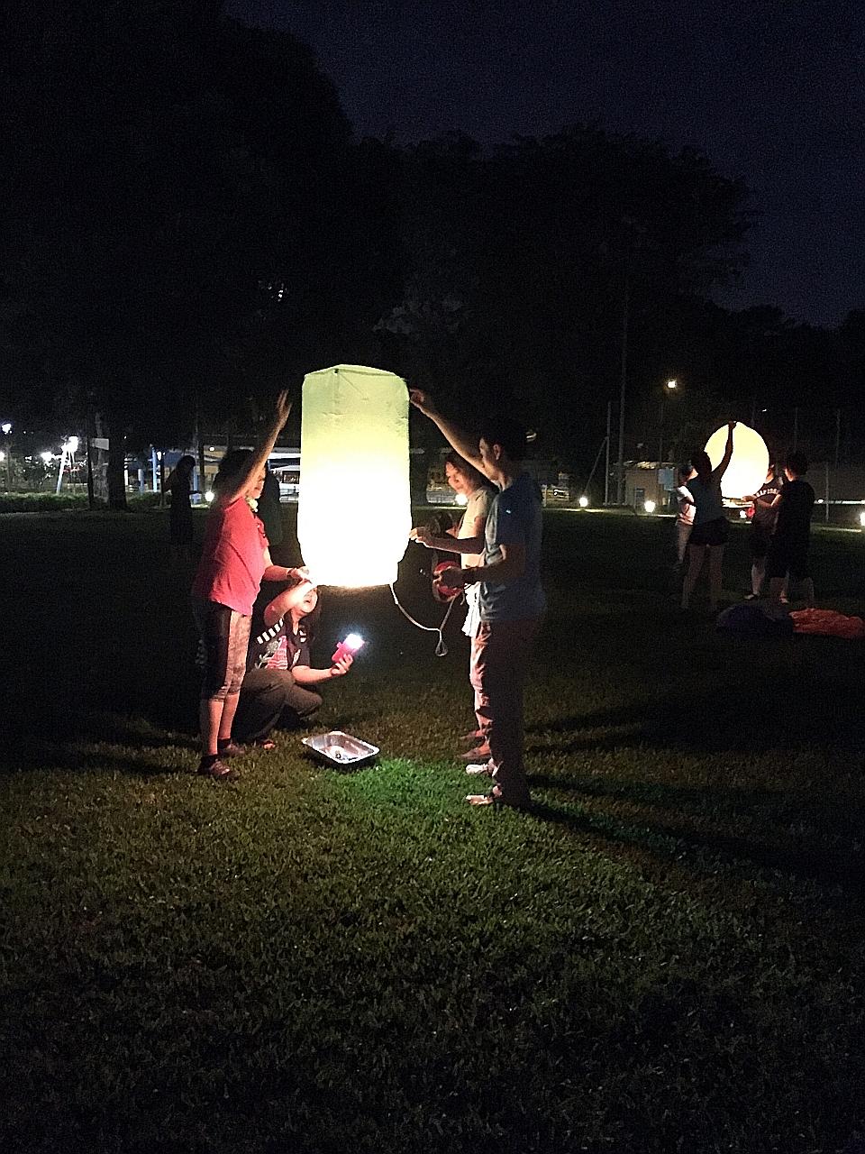 Sky lanterns being released during this year's Mid-Autumn Festival. Hopes and wishes are written on the lanterns before being released.